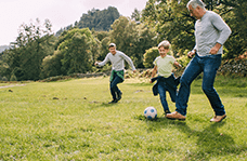 Family playing soccer
